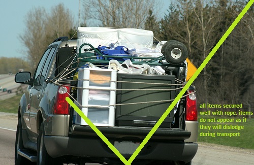 all items secured well with rope, items do not appear as if they will dislodge during transport